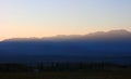 Sunset in the mountains of Kyrgyzstan. A bright orange sunset