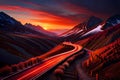 Sunset in the mountains with light trail of vehicles in the road Royalty Free Stock Photo