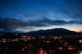 Sunset in the mountains near the Black Sea in Crimea, Novy Svet, summer, Genoese fortress, night city in lights. Royalty Free Stock Photo