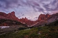 Sunset in mountains near lake. Sunlight reflected on mountain tops. Golden light from sky reflected in a mountain lake. Ergaki. Royalty Free Stock Photo