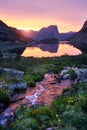 Sunset in mountains near river. Sunlight reflected on mountain tops. Golden light from sky reflected in a mountain river. Ergaki. Royalty Free Stock Photo