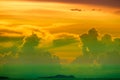 sunset multicolor cloud back on dark silhouette sky and fishing boat on sea