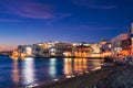 Sunset in Mykonos, Greece, with cruise ship and yachts in the harbor Royalty Free Stock Photo