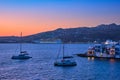 Sunset In Mykonos, Greece, With Cruise Ship And Yachts In The Harbor