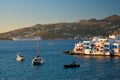 Sunset in Mykonos, Greece, with cruise ship and yachts in the harbor Royalty Free Stock Photo