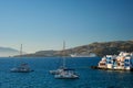 Sunset in Mykonos, Greece, with cruise ship and yachts in the harbor Royalty Free Stock Photo