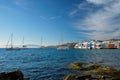 Sunset in Mykonos, Greece, with cruise ship and yachts in the harbor Royalty Free Stock Photo