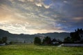 Sunset with a mystical and beautiful sky. Black clouds against the background of mountains. Austria, Alps, Bad Goisern. Royalty Free Stock Photo