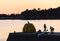 Sunset at naoshima: Tourists and the pumpkin.