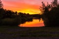 Amazing evening sky with a reflection in a pond at a former mining area in Waterschei near Genk