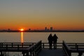 Sunset near the river with the silhouet of a beautiful house. Royalty Free Stock Photo