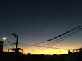 Sunset in a neighborhood of sao paulo, brazil south america. With wires, electricity pole and satellite dishes. Royalty Free Stock Photo