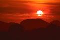Sunset on night red sky back over silhouette tree mountain Royalty Free Stock Photo