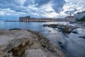 Sunset and Night view of Dubrovnik old town from seaside with reefs in foreground, Croatia Royalty Free Stock Photo