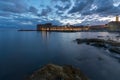 Sunset and Night view of Dubrovnik old town from seaside with reefs in foreground, Croatia Royalty Free Stock Photo