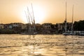 Sunset Nile Aswan the West Bank with small village houses with fishing sailing boats felucca Royalty Free Stock Photo