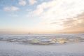 Winter sunset by the beach, icy sea Royalty Free Stock Photo