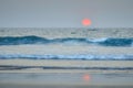 Sunset in the ocean against the backdrop of waves. Goa coastline Royalty Free Stock Photo