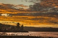 Sunset on the ocean with colored clouds