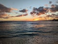 Sunset: Ocean and Mountain Embrace the Horizon at Waikiki Beach, Oahu Royalty Free Stock Photo