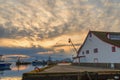 Sunset on the ocean at the pier of fishing ships Royalty Free Stock Photo