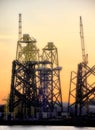 Sunset at an offshore wind turbine base construction site on the River Tyne Royalty Free Stock Photo