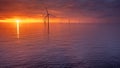 Sunset offshore at wind turbine farm Royalty Free Stock Photo