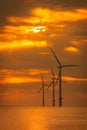 Sunset Offshore Wind Turbine in a Wind farm under construction Royalty Free Stock Photo