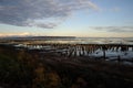 Sunset with old pylons and mountains in background