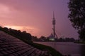 Sunset in the Olympiapark in Munich with view on the lake and tower