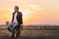 Sunset one young man leather jacket posing Royalty Free Stock Photo
