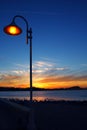 Sunset orange blue seascape light lamppost Royalty Free Stock Photo