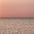 Orange clear sky sunset with divided sea horizon view Royalty Free Stock Photo