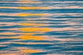 Sunset orange colors reflecting in ocean waves. Royalty Free Stock Photo