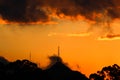 Sunset orange with rain clouds and mountain.