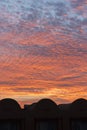 sunset with orange sky. Hot bright vibrant orange and yellow colors sunset sky. sunset with clouds. vertical photo Royalty Free Stock Photo