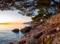 Sunset over the Adriatic Sea and the coastline in Brela, Croatia Royalty Free Stock Photo