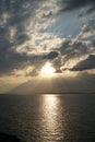 Sunset over the Aegean Sea over the islands in the cloudy sky Royalty Free Stock Photo