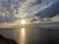 Sunset over the Aegean Sea over the islands in the cloudy sky Royalty Free Stock Photo