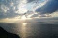 Sunset over the Aegean Sea over the islands in the cloudy sky Royalty Free Stock Photo