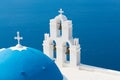 Sunset over aegean sea with view to Virgin Mary Catholic Church Three Bells of Fira, Santorini. Royalty Free Stock Photo