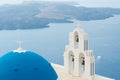Sunset over aegean sea with view to Virgin Mary Catholic Church Three Bells of Fira, Santorini. Royalty Free Stock Photo