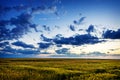 Sunset over agricultural field Royalty Free Stock Photo