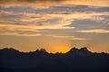 Sunset over the Alps. Colorful sky, high altitude mountain peaks with glaciers, Massif des Ecrins National Park, France. Telephoto Royalty Free Stock Photo