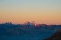 Sunset over the Alps. Colorful sky, high altitude mountain peaks with glaciers, Massif des Ecrins National Park, France. Telephoto Royalty Free Stock Photo