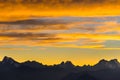 Sunset over the Alps. Colorful sky, high altitude mountain peaks with glaciers, Massif des Ecrins National Park, France. Telephoto Royalty Free Stock Photo