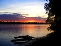 Sunset Over The Amazon River with a Wooden Boat Royalty Free Stock Photo