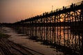 Sunset over Ancient mon wooden bridge in songgaria river Sangkhla Buri District kanchanaburi thailand