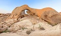 Sunset over arch in Joshua Tree National Park. Royalty Free Stock Photo