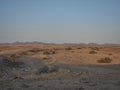 sunset over the arid landscape of the Kaokoveld Royalty Free Stock Photo